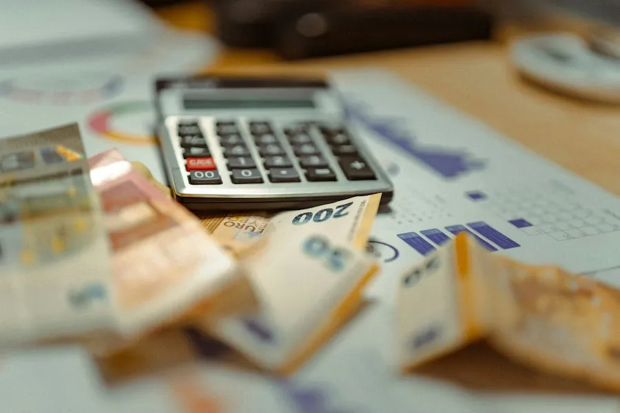 A calculator resting on a stack of banknotes