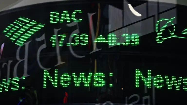 Market board showing green price digits