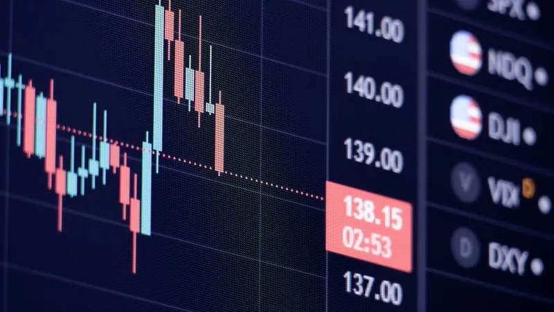 A monitor showing market data