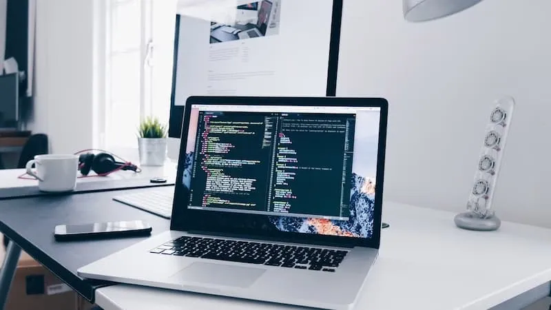 A laptop screen showing code