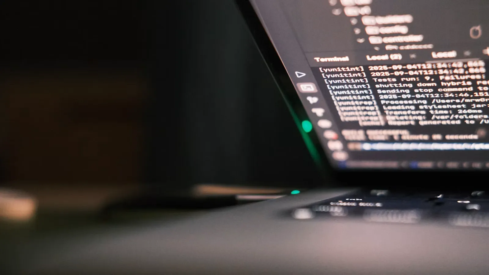 A laptop screen displaying lines of code