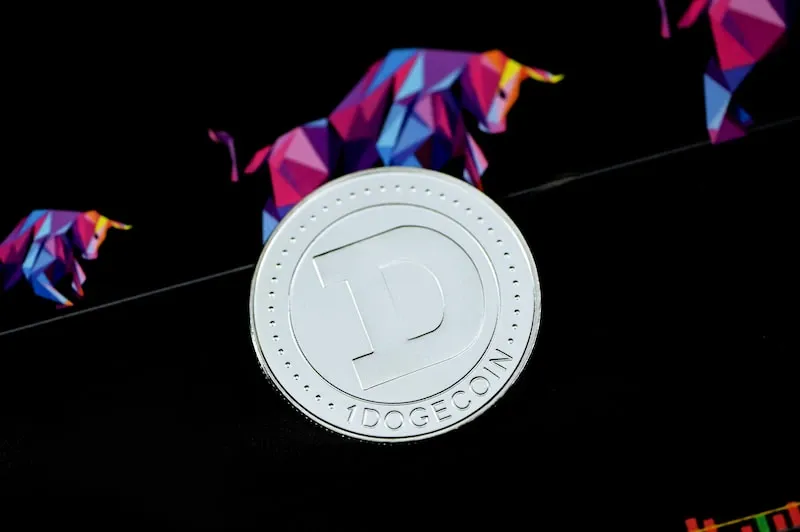 A close-up of a coin on a dark surface