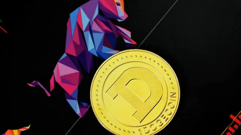 A gold coin on a dark surface