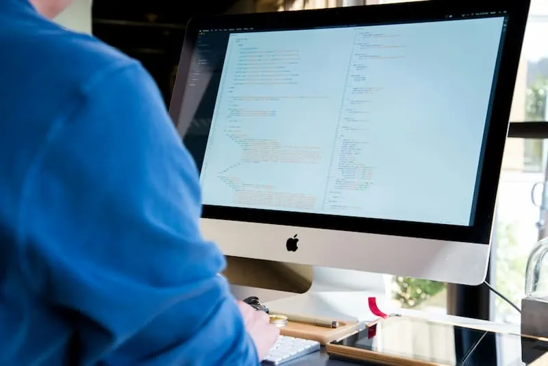 A developer working at a desktop computer