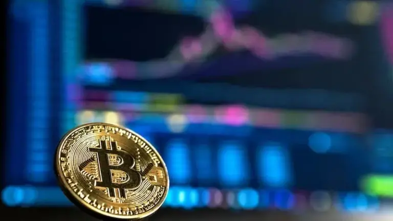 A gold-colored coin on a surface