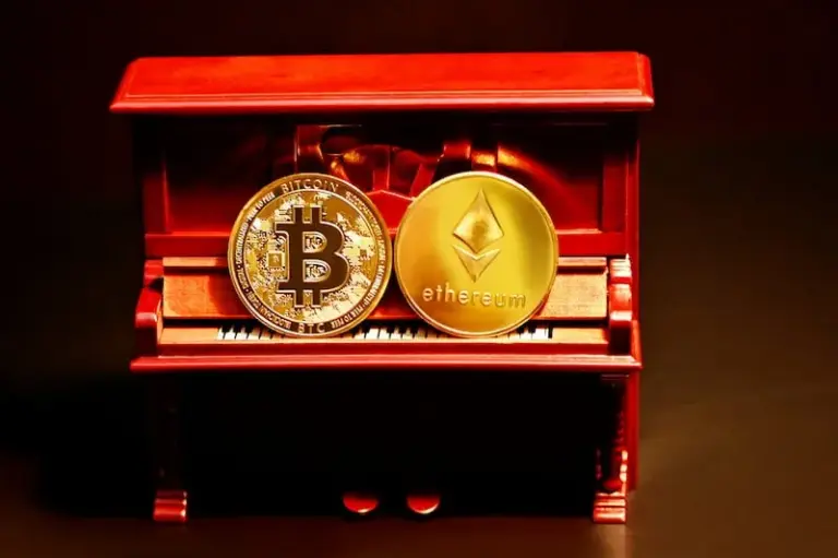 Two gold coins on a red box