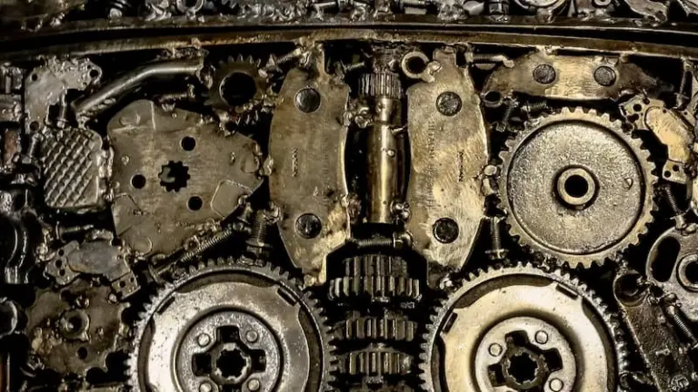 An intricate metal sculpture made of gears and machine parts