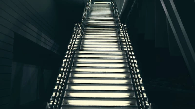 A low-angle view of gray steps rising upward