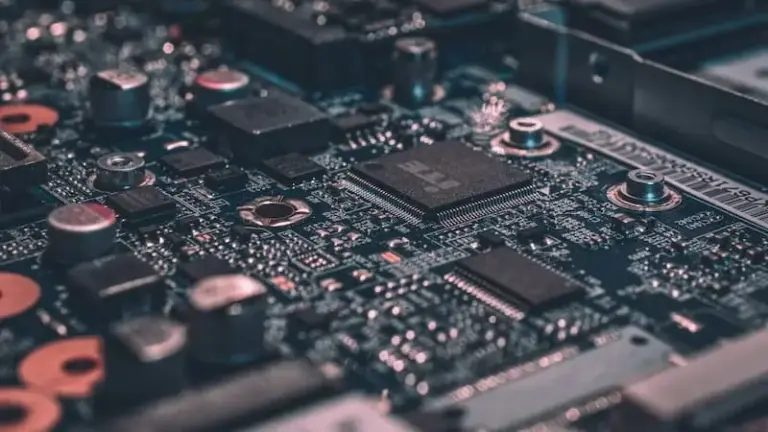 A macro photograph of a black circuit board