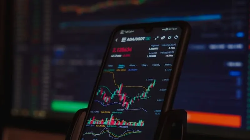 A smartphone trading app on a table