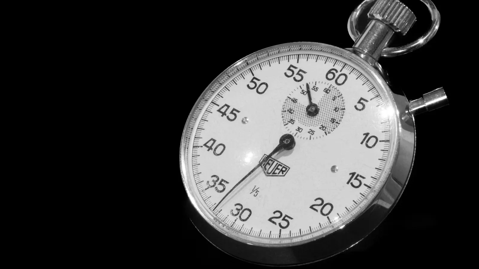 A stopwatch on a black background