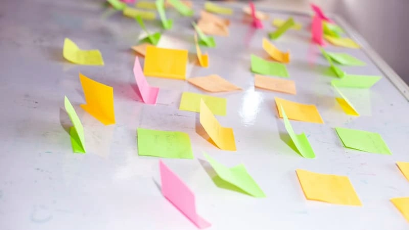 Colorful sticky notes on a board