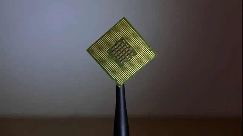 A processor held by tweezers