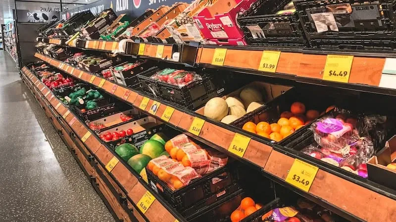 Assorted fruits on a wooden shelf
