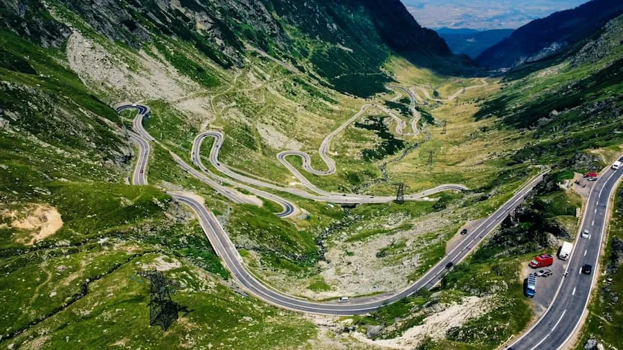 An aerial view of a winding mountain road