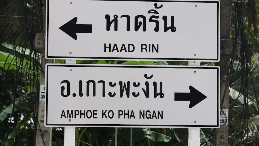 A street signpost with two arrows pointing in different directions